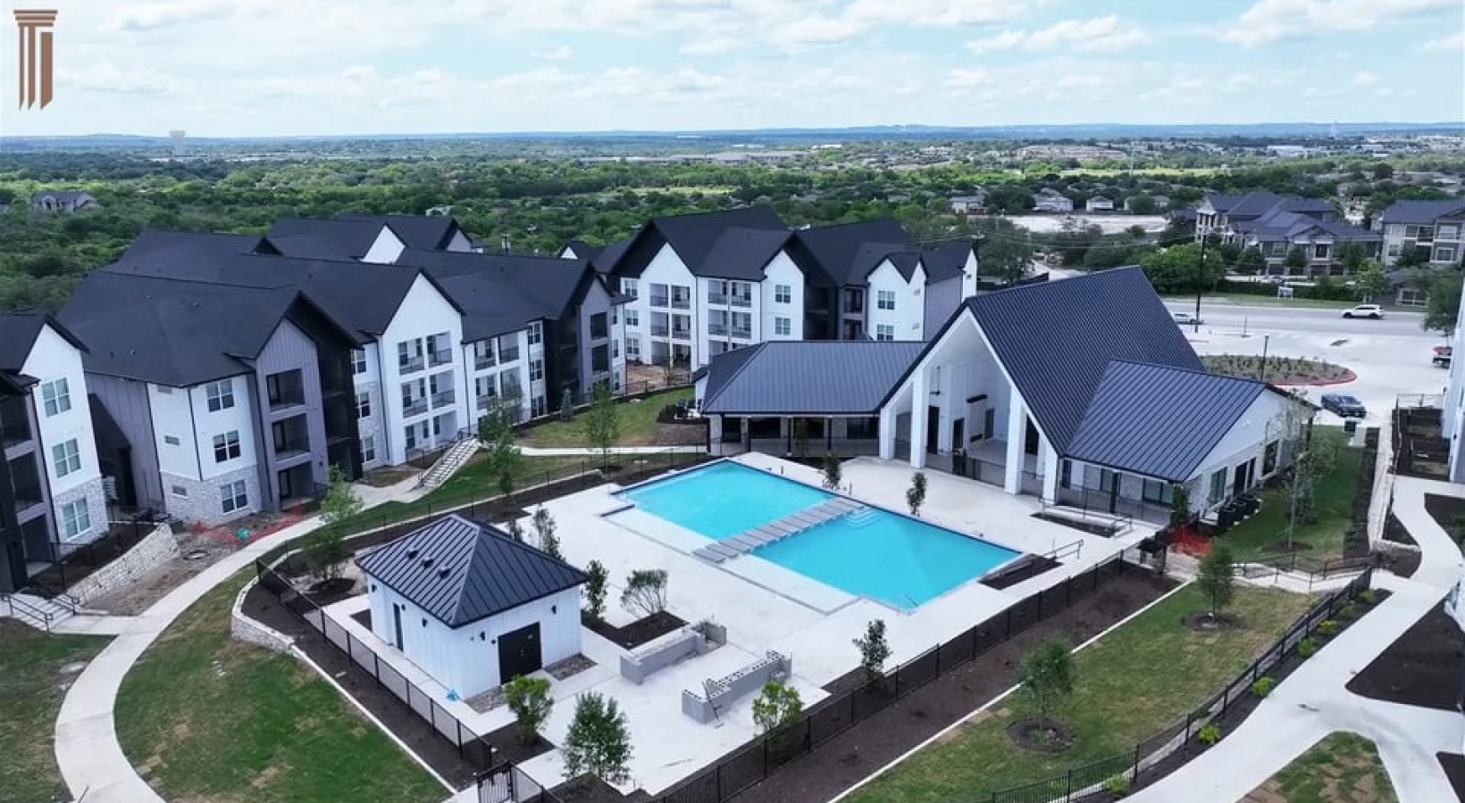 aerial view of large pool and buildings